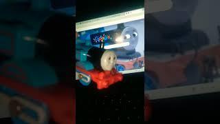 Thomas explainimg how to use a computer to Percy