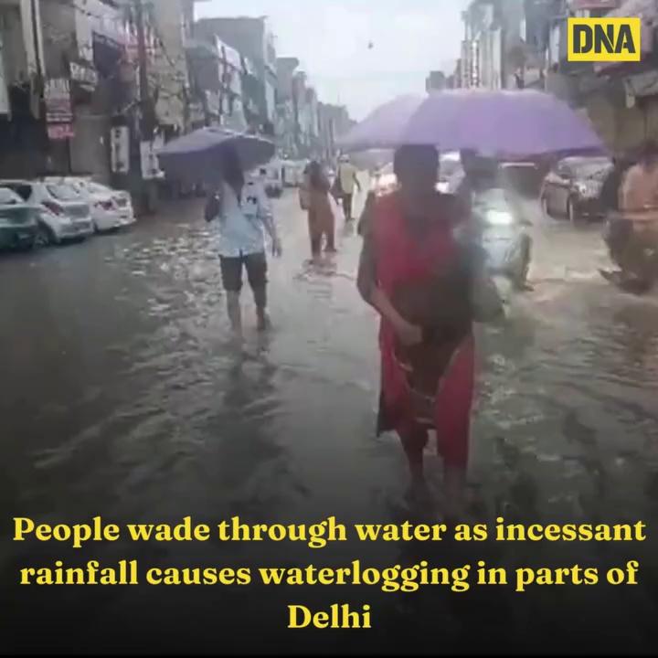 People wade through water as incessant rainfall causes waterlogging in parts of Delhi; visuals from Mehrauli Badarpur Road