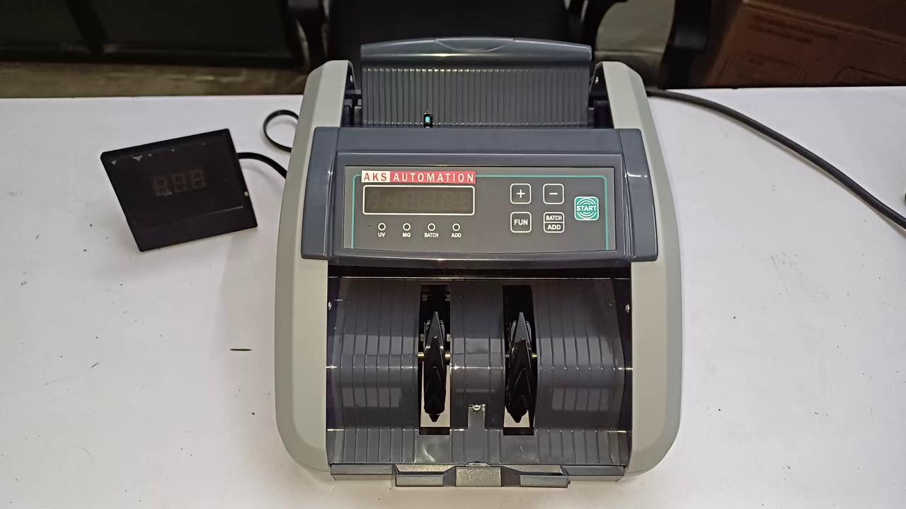 AKS Automation India’s Best Currency Counting Machine Dealers Near Karol Bagh, Delhi. Telephone
09540900557, Mobile ? & WhatsApp 9818409728. The Best Cash Counting Machines Suppliers for Delhi, Gurugram, Noida, Ghaziabad, Faridabad, and all India. Buy Currency Counting Machines at affordable prices with a 1-year warranty. You can also buy these currency counting machines online from our website.