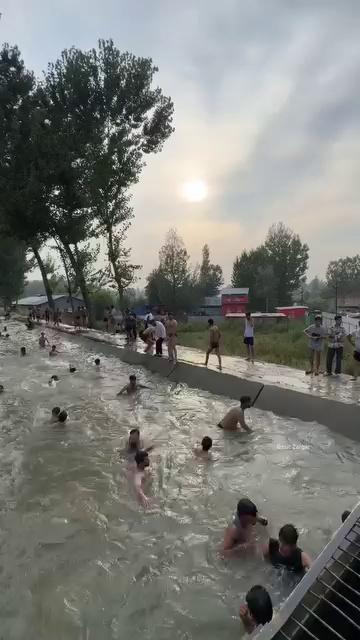Beat the scorching summer heat in a canal in Pulwama ...
