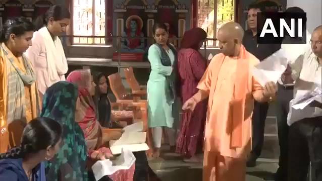 Gorakhpur: Uttar Pradesh CM Yogi Adityanath listens to the grievances of the public during his 'Janta Darshan' program, in Gorakhnath temple.