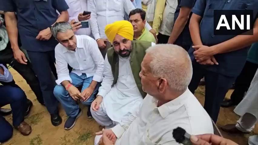 Punjab CM Bhagwant Mann meets Indian wrestler Vinesh Phogat's uncle Mahavir Phogat in Charkhi Dadri, Haryana