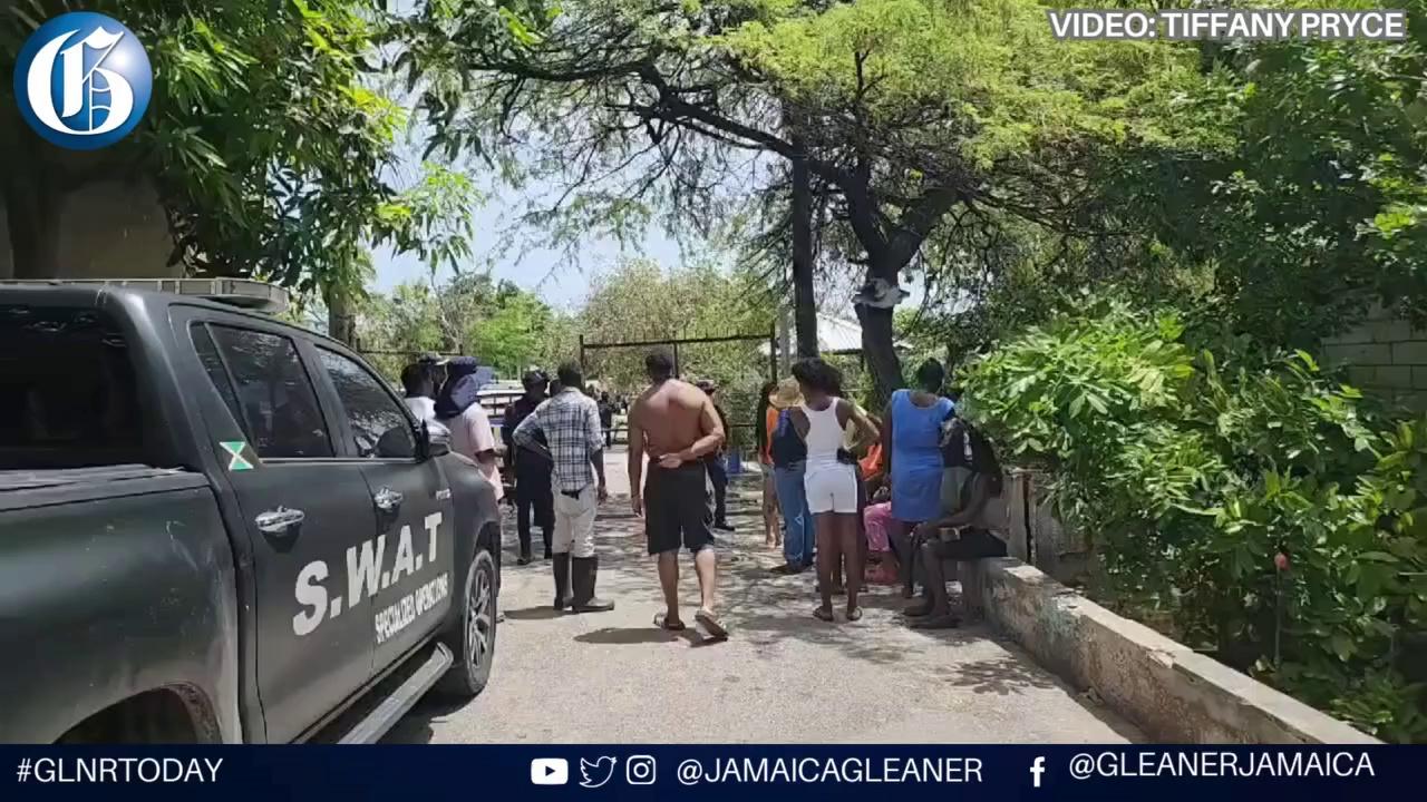 Two individuals were shot on 5th Street in Greenwich Farm, Kingston. One man was pronounced dead, while a woman identified as Candy sustained leg injuries. Senior Superintendent of Police Damion Manderson has declared the area as an active shooting scene and is keeping order among local residents present in the vicinity.