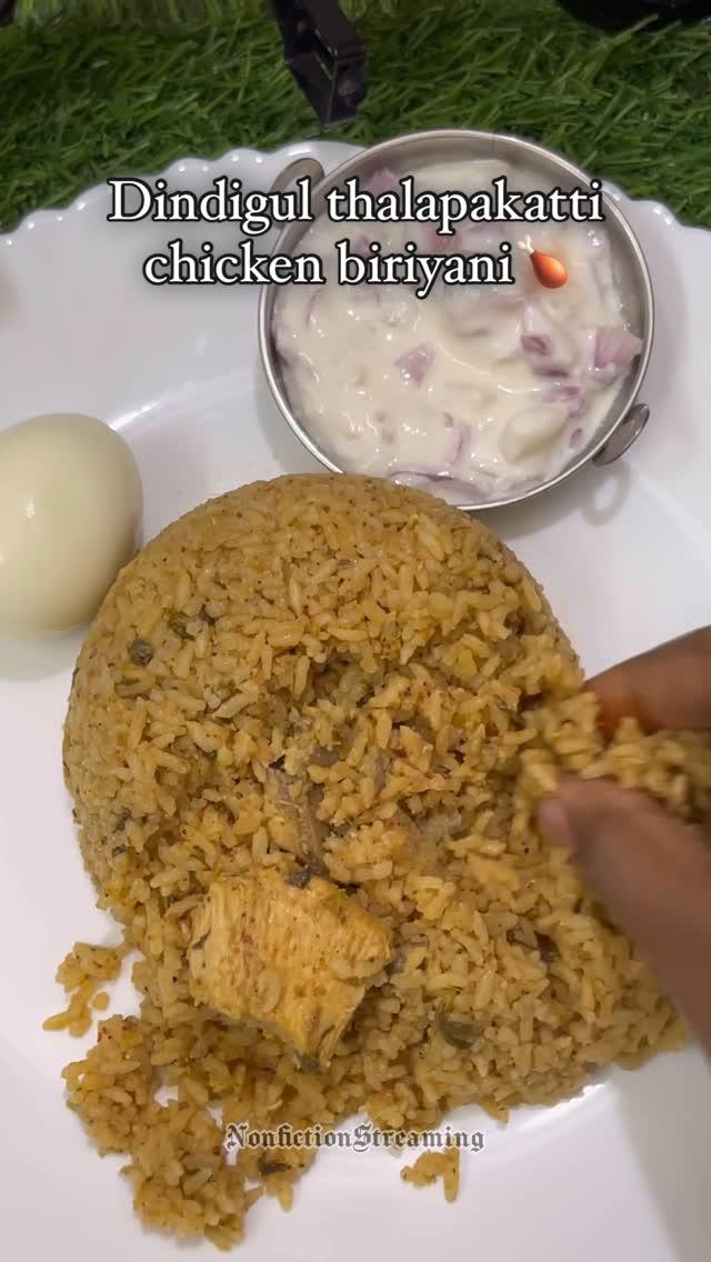 Dindigul thalapakatti style chicken biriyani🍗😍

Ingredients 

For chicken marination,

Chicken - 300 gms
Curd - 1 tbsp
Ginger-garlic paste - 1 tsp
Salt

For biriyani masala,

Coriander - 1 tbsp
Cumin - 1 tsp
Fennel - 1/2 tsp
Pepper - 1/2 tsp
Cinnamon - 1
Cloves - 5
Star anise - 1
Stone flower - 1
Javithri - 1
Bay leaf - 1
Red chilli - 5 or red chilli powder - 1 tbsp (adjust per your spice level)
Cashews - 5-10
Cardamom - 2

For biriyani,

Oil - 1 tbsp
Ghee - 1 tbsp
Onion paste -  20 shallots 
Ginger-garlic paste - 1 tsp

Note : Also onion, garlic, ginger & green chilli can be grinded instead of onion paste & ginger-garlic paste✌🏼

Tomato - 1 (optional)
Salt to taste
Grounded biriyani masala
Mint leaves - handful
Coriander leaves - 5 strands 
Marinated chicken
Soaked seeraga samba rice - 1 cup
Water - 1.5 cups
Lemon - 1