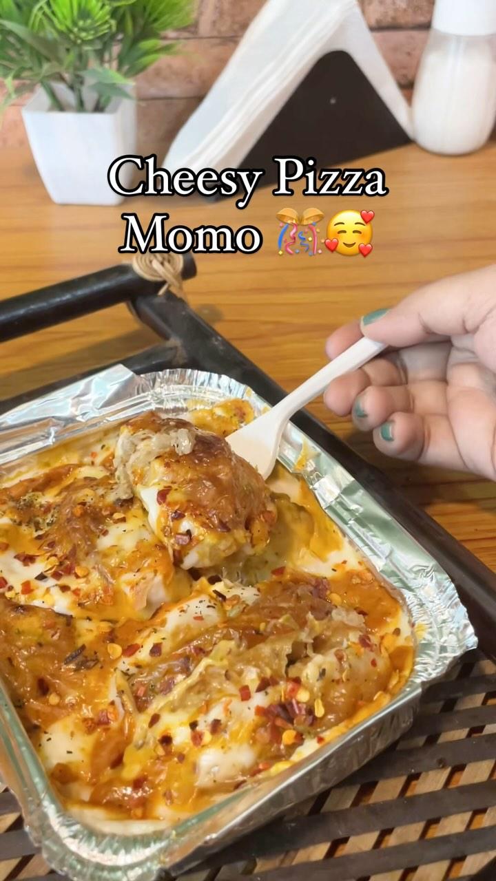 Get ready for a flavor explosion! Introducing our signature Cheesy Pizza Momo - a mouth-watering fusion of Italian pizza and Tibetan momos
Soft, juicy momos filled with melted cheese, tangy tomato sauce, and savory pizza seasonings
A taste sensation that will leave you craving for more!