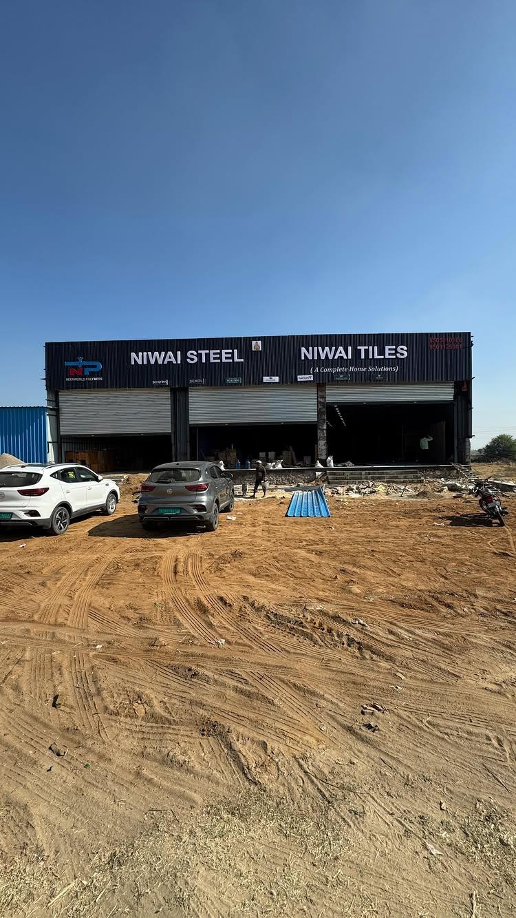 🎉 Grand Opening of the Largest Showroom in Tonk, Niwai, and Chaksu! 🎉

We’re thrilled to announce the opening of Niwai Tiles & Steel, the largest showroom in the region, bringing you an unmatched selection of premium tiles and building materials! 🌟

📍 Located on Main Tonk Road, Kota Highway, Niwai Moad, we are here to serve the communities of Niwai, Tonk, Vanasthali, and Chaksu with the best products for your construction and interior needs
Whether you’re building your dream home or upgrading your spaces, our showroom offers the widest range, premium quality, and expert guidance—all under one roof!

✨ Get ready to experience convenience, luxury, and excellence like never before
Let’s make your spaces extraordinary!