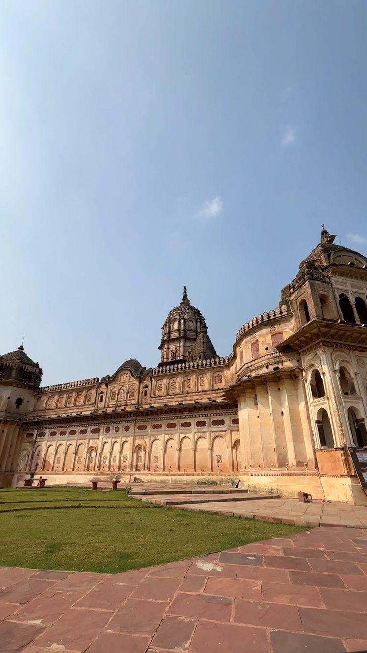 Offbeat Madhya Pradesh: Episode 5

Tucked away in the historic town of Orchha, the Lakshmi Narayan Temple is a treasure trove of architectural and artistic excellence
This ancient temple, built in the shape of a Shree Yantra, not only boasts of its unique design but also houses an impressive collection of paintings that adorn its walls and ceilings
As one enters the temple, they are greeted by the striking engraved paintings that adorn the walls on either side of the entrance passage
These paintings, created using a unique technique, feature a predominantly red and white color palette
The process of engraving involves applying white plaster to the wall, followed by a layer of red oxide
The figures are then carefully drawn by scratching off the surface of the wall, revealing the white plaster beneath
The themes depicted in these wall paintings are fascinating, showcasing everyday life scenes, such as a lady drying her hair, wrestlers engaged in combat, and royal personages riding elephants
These intricate paintings offer a glimpse into the lives of the people who created them, providing a unique window into the past
In addition to the engraved paintings, the temple also features an impressive collection of frescoes
These paintings, created on wet plaster, have become an integral part of the wall, ensuring their longevity and preservation
The frescoes on the ceiling of the temple are particularly breathtaking, depicting a range of mythological and historical scenes, including the famous battle of Jhansi
Follow udtekabootar for more such content