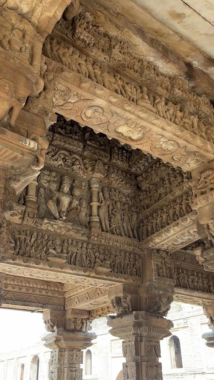 Offbeat Madhya Pradesh: Episode 8

Hidden in a quiet village of Madhya Pradesh, the Garhi Padhavali Temple might not stand in its full glory today, but its charm is undeniable
Built around 925 CE during the Kachhapaghata dynasty, this temple is considered one of the most intricately carved mandapas of pre-12th century India
Padhavali was once a thriving ancient city, first mentioned in a 7th-century inscription
By the 8th to 12th centuries, it became a significant hub for learning, sharing its importance with nearby Mitawali (home to the Chausath Yogini Temple) and Bateshwar, a site with over 200 small Hindu temples
Over time, the city faded into a small village, and the temple suffered considerable damage
In the 18th century, the Jat rulers from Rajasthan built a fort around the temple ruins to protect what remained
Fast forward to the 1920s, the princely state of Gwalior removed later modifications, revealing the original mahamandapa, which continues to awe visitors today
This surviving structure, with its sixteen beautifully carved pillars, high plinth, and open design, is a treasure trove of stories
Every inch of the mandapa is adorned with breathtaking carvings—miniatures so detailed, they seem to come alive
The panels celebrate the diverse traditions of 10th-century Hinduism, from Shaivism and Vaishnavism to Shaktism and even tantric practices
Scenes from the Ramayana, Mahabharata, and myths like the Samudra Manthan grace its walls
Sadly, the sanctum and shikhara were destroyed after the 13th century, and numerous statues and temple fragments were lost to time
Some of these pieces now rest in museums, including the Gwalior Museum
Despite its partial survival, the Garhi Padhavali Temple is a living example of the artistry and spiritual richness of our ancestors
Garhi Padawali, Morena Dist
M.P
Follow udtekabootar for more such content