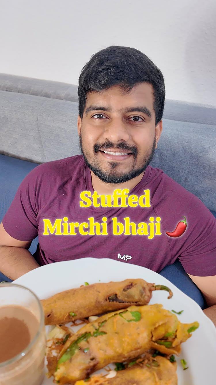 Save and Send it to your partners for a mirchi bhaji party 🎊🤣🌶️

This  snack i.e
stuffed mirchi/menasinakai  bajji  is typically served as snack with masala chai especially during winter
All you need is-
for batter: 
1 cup chickpea flour, 1/4 cup rice flour, turmeric powder, hing, ajwain, salt, baking sode, 1/4 cup water
for stuffing
2 onions, coriander leaves, salt, chilli powder, jira, sugar, coriander powder, chat/garam masala, jaggery, tamarind paste
To prepare-
Besan Batter:
1
take besan, rice flour, chili powder, turmeric powder, hing and salt
mix well
2
add water and baking sode and make a smooth batter
3
add all the ingedients mentioned above stuffing and give a gentle mix
4
For the chilli, slit it as shown and deseed it
5
Add the stuffing
6
dip the stuffed chili into besan batter, coat and deep fry to golden brown

Serve it hot and this is how my Praju likes it, and you would like it to in this cold winters
jeebhar #mirchi #mirchibhaji #northkarnatakafood #uttarkarnataka #indiancuisine #snacks #traditionalrecipe #indianfoodbloggers #vegetarianrecipes #hubli #belgaum #dharwad #northkarnataka #karnatakafood #glutenfreerecipes #indianspices #homemadegoodness #foodsofindia #regionalrecipes #instafoodies #reelkarofeelkaro #explorepage #foodielife #foodiesofinstagram #homemaderecipes  #Germany #Indian #international #India

[ Uttar Kannada | Kannada | Uttar karnataka | cooking | food | Karnataka | Belagavi | Hubbali | Dharwad | couple | Germany | indian ]